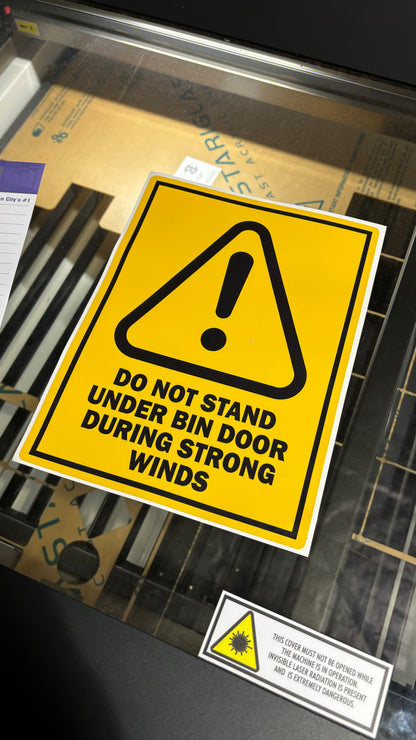 Do not stand under door safety signage